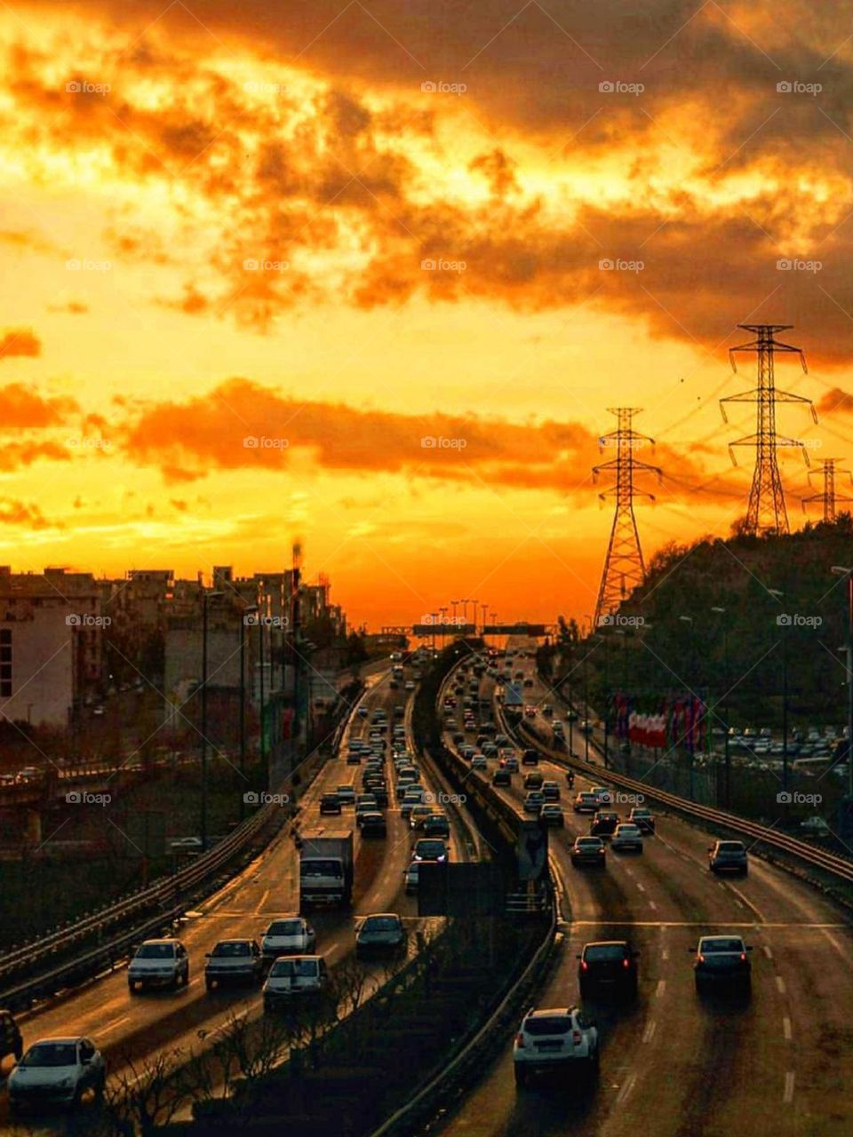 The beautiful sunset view of the city and the traffic of the cars are beautiful