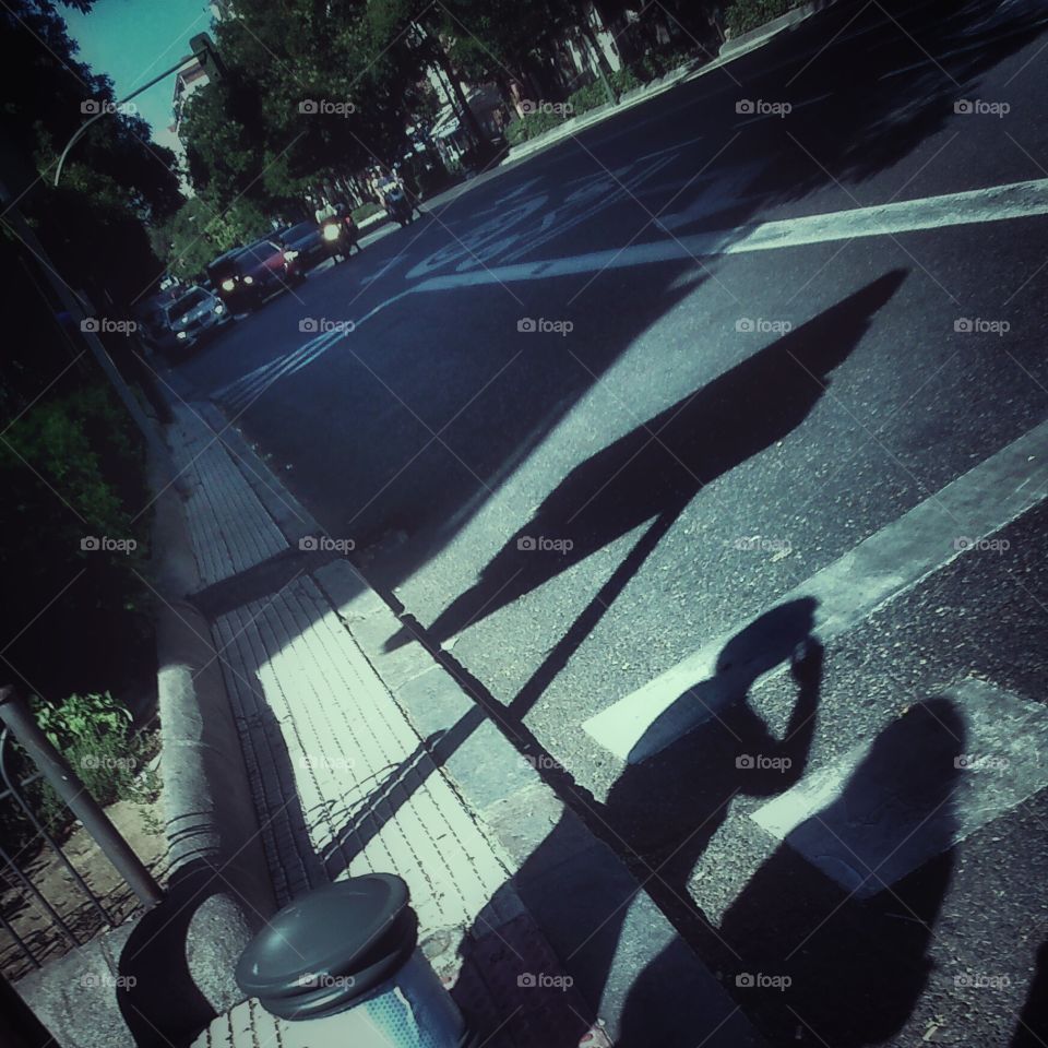 Shadows. Hot, sun, shadows waiting for cross the street