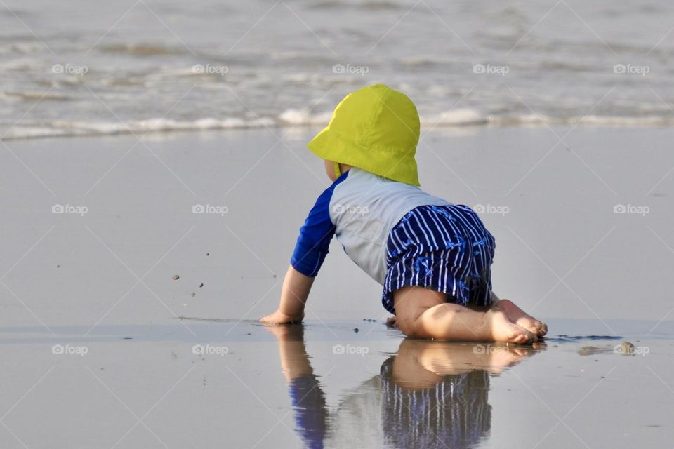 Dressed for summer at the beach, baby