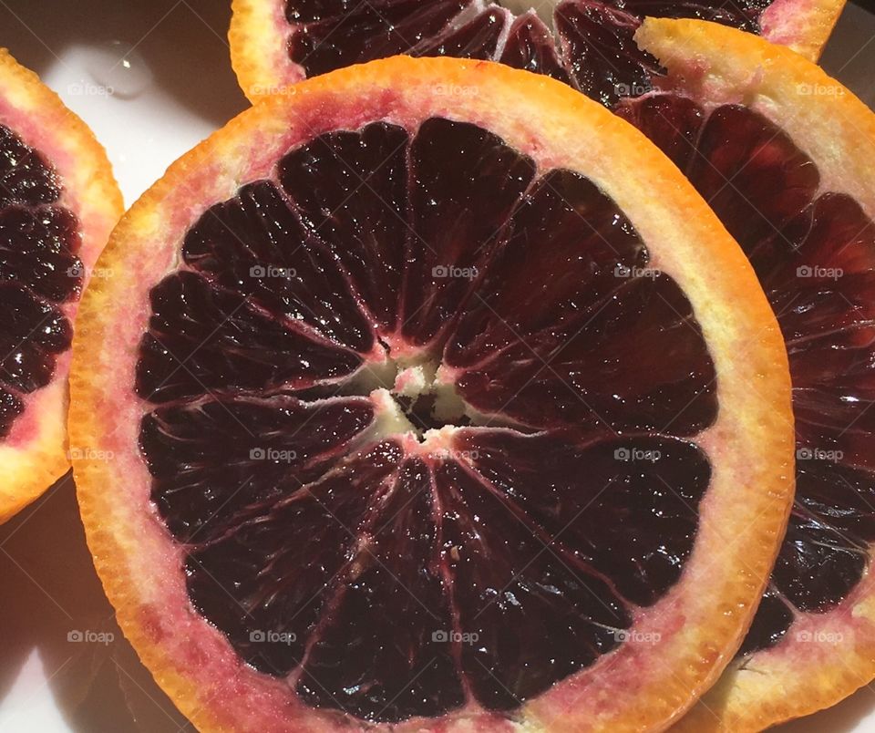 Slice- A slice of a juicy blood orange.  