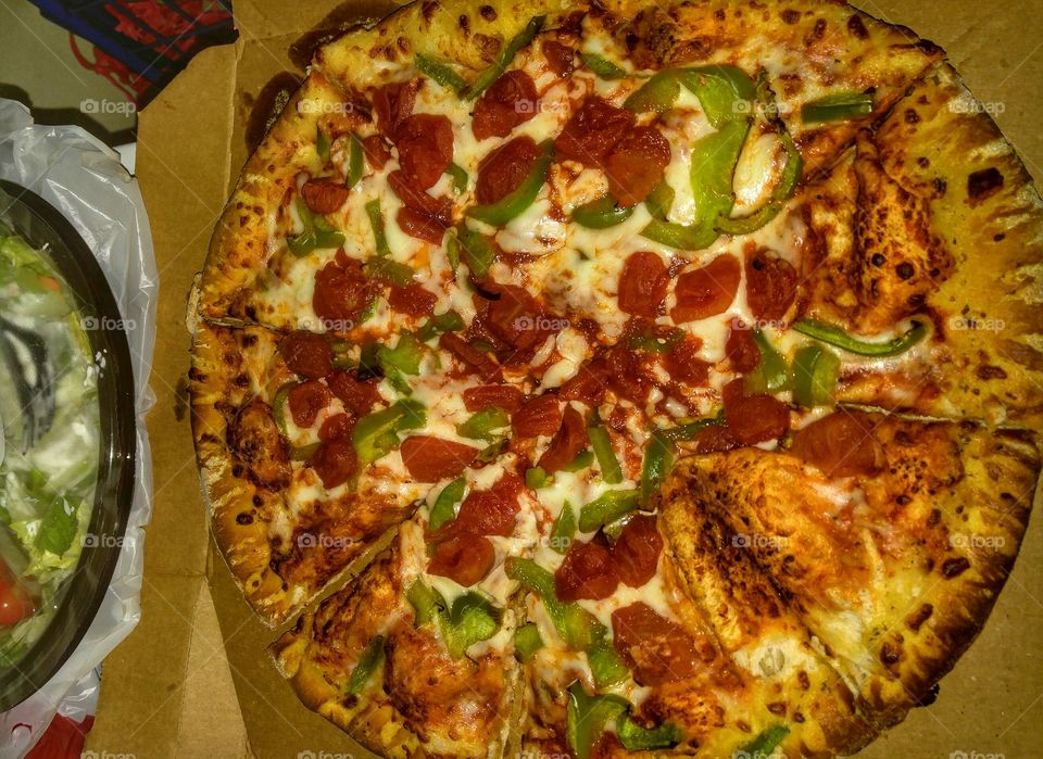 Medium two toppings pizza (Tomatoes and green peppers)