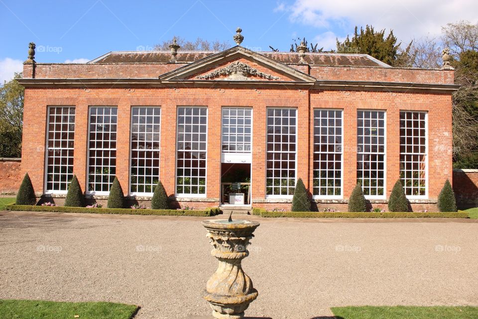 Orangery with sundial in foreground 