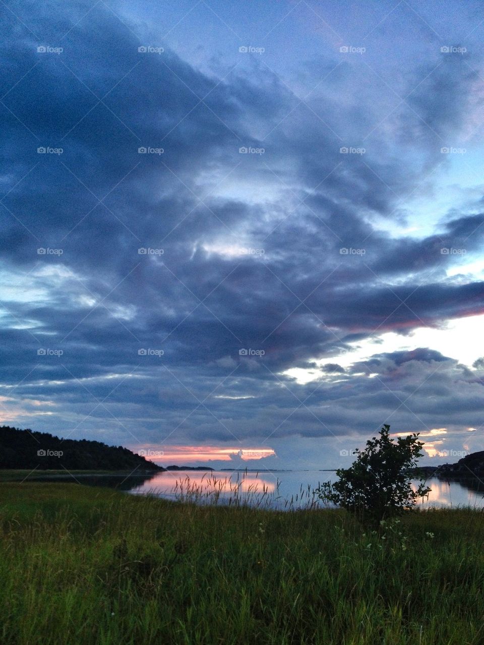 Idyllic lake against cloudysky