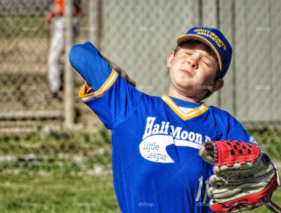 Boy Throwing A Baseball
