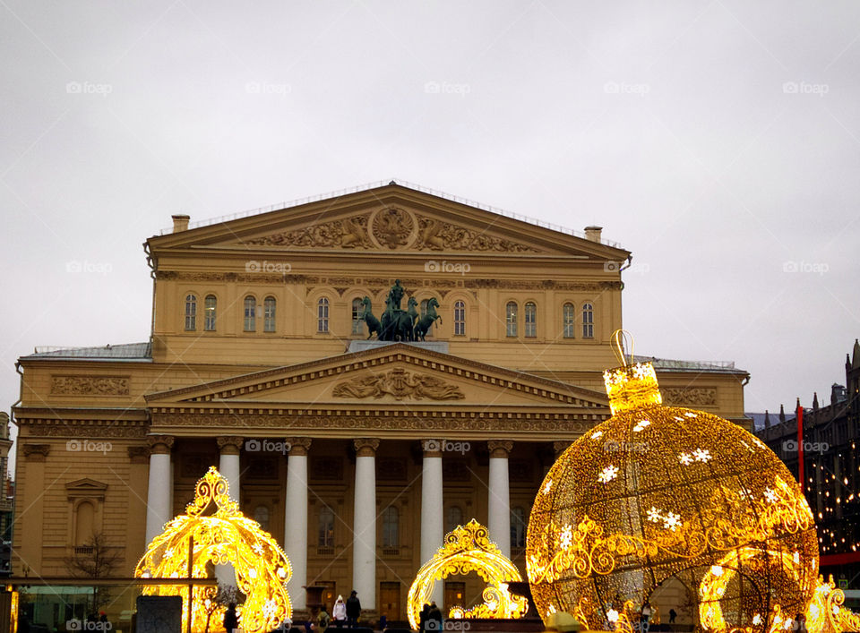 Huge glowing Christmas balls in front of the Bolshoi Theater in the afternoon