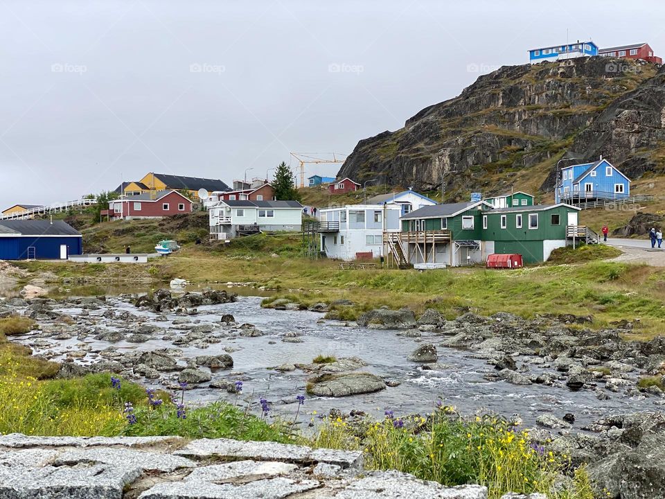 A stream running through a small town in Greenland 