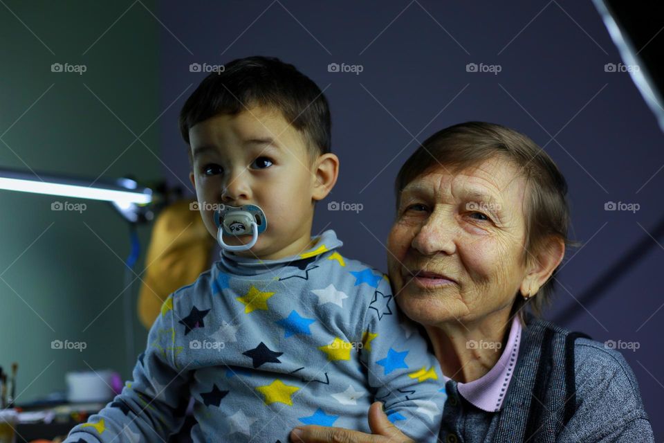 grandmother with grandson portrait in the room