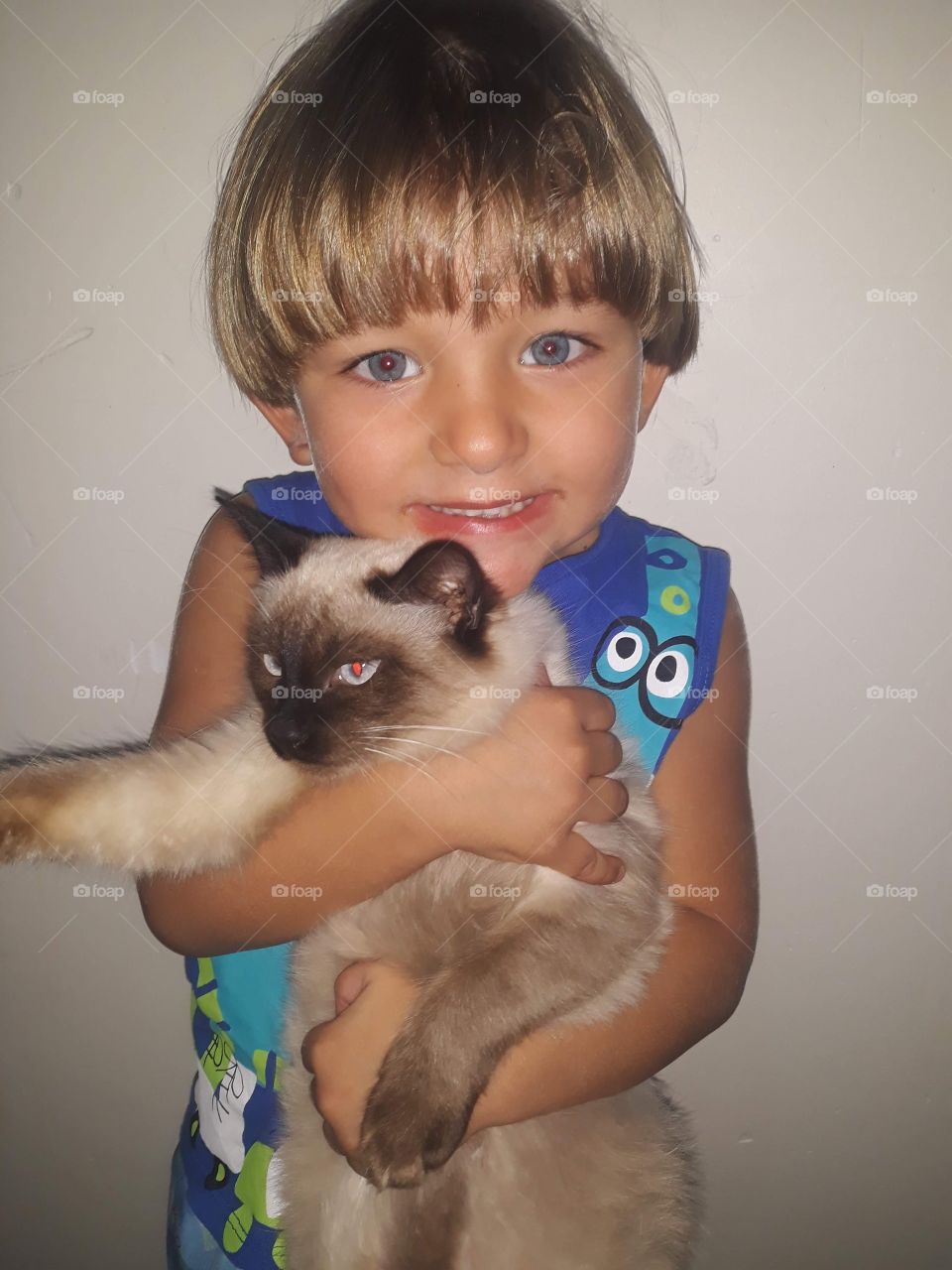 cute child smiling with cat