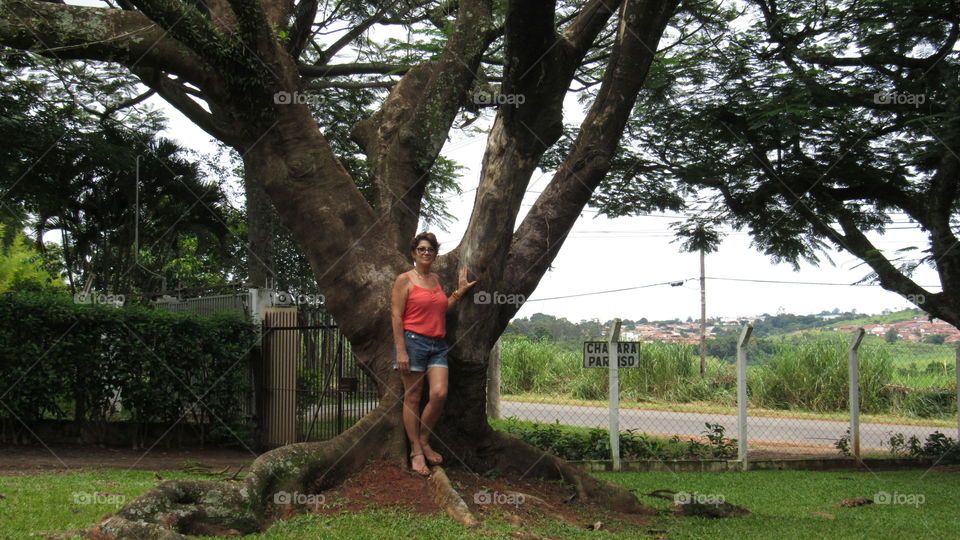 woman posing at tree