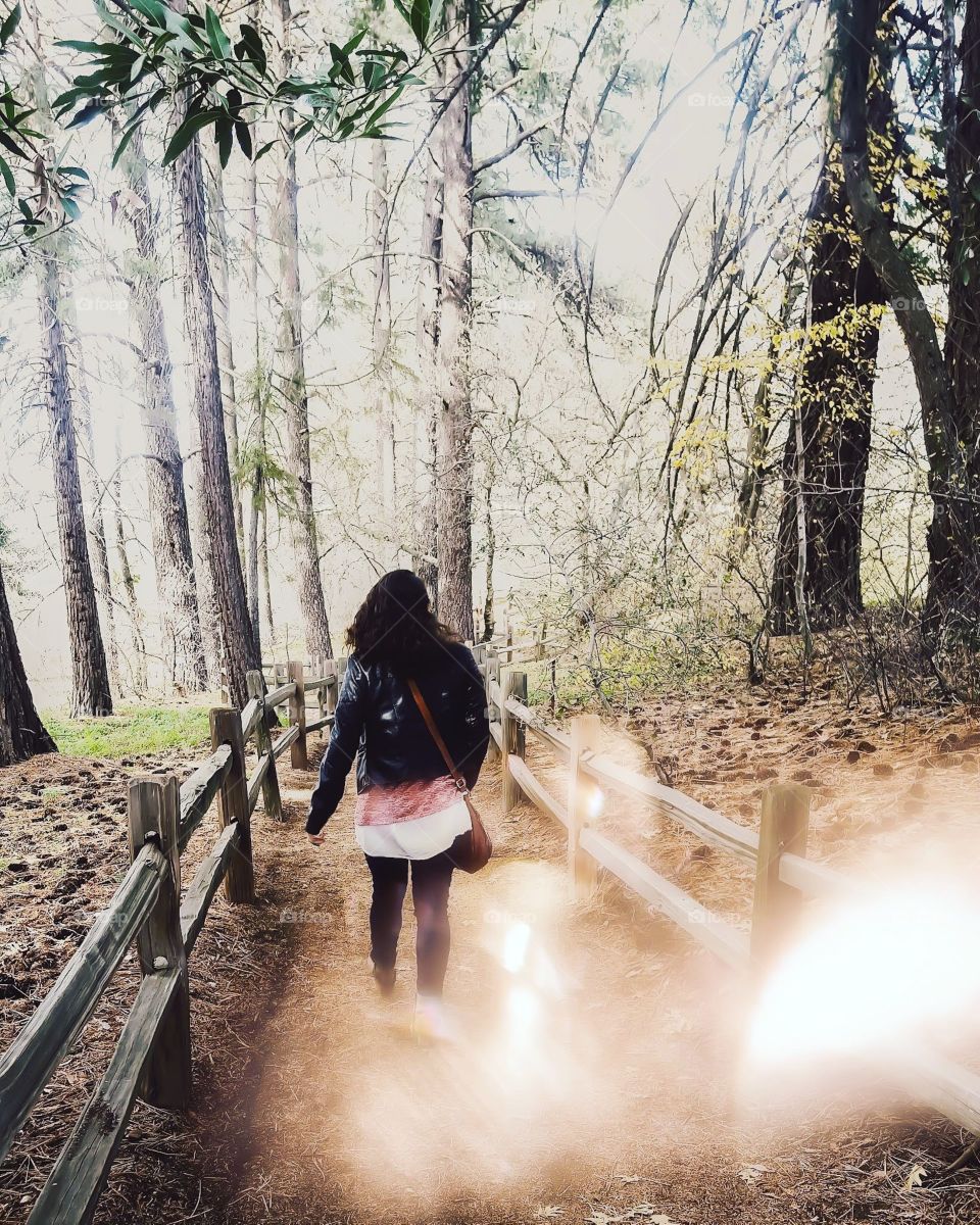 girl walking in the woods