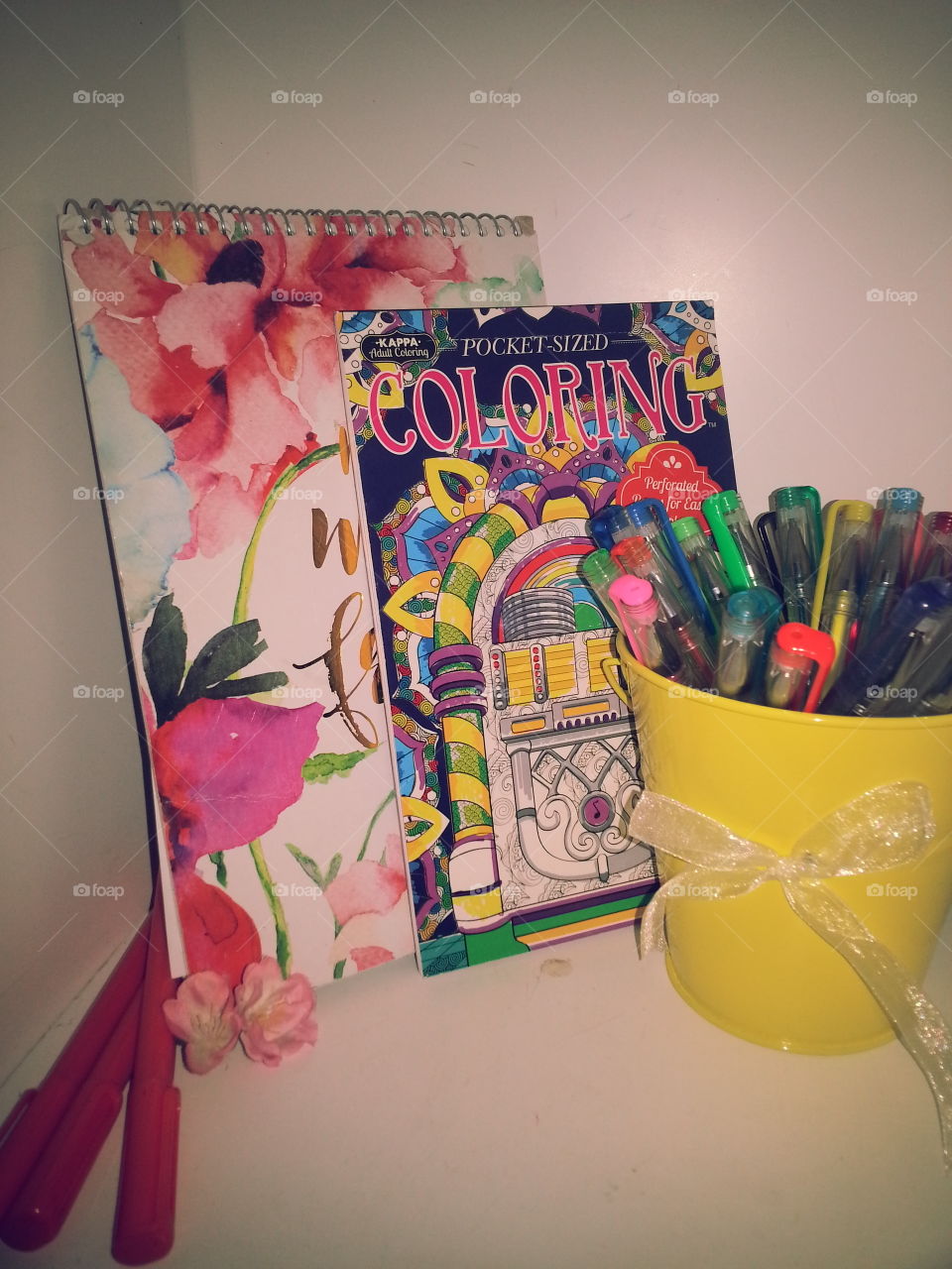 Colorful pens and color book