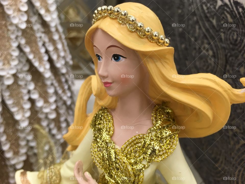 This blonde doll is wearing every shade of yellow. From gold to vivid yellow 