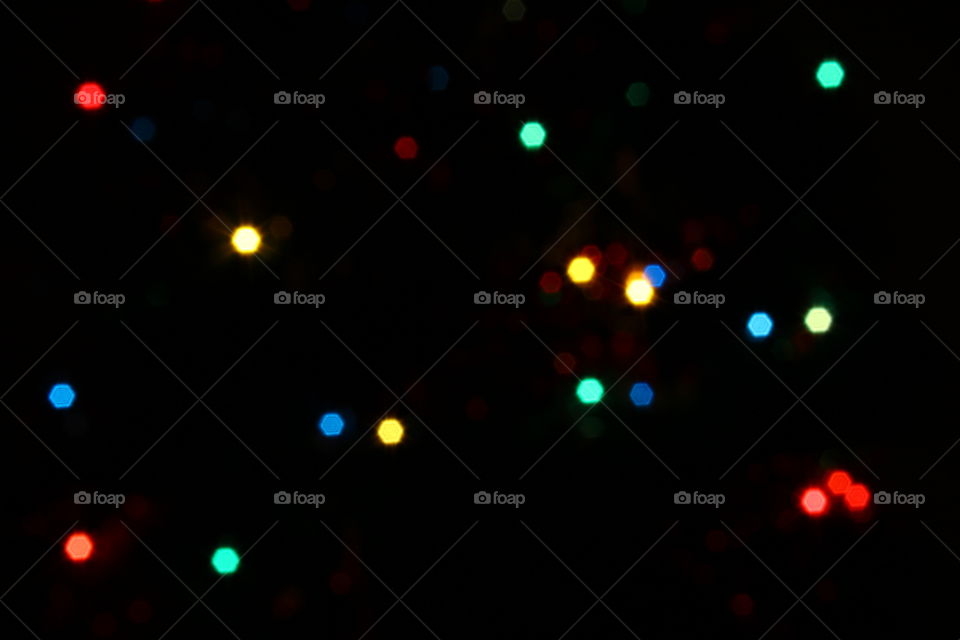 Macro shot of Christmas tree decorations and vivid lights