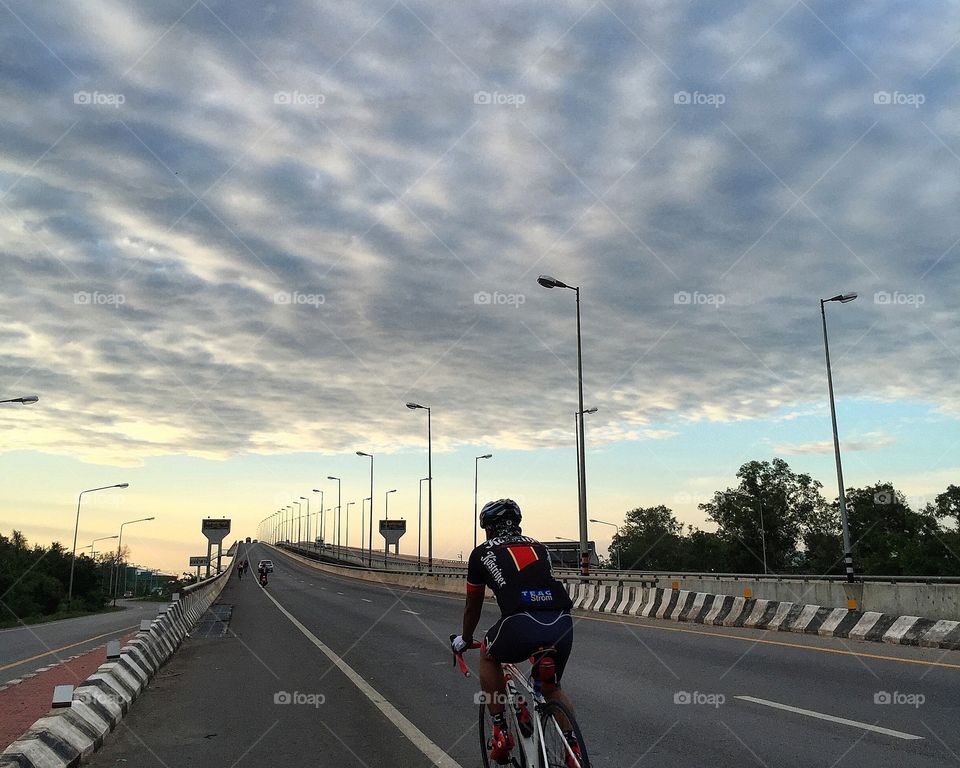 Cycling under the amazing clouds
