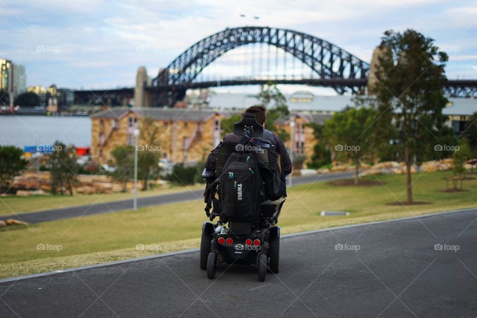 Wheelchair traveler at Harbour Bridge, Sydney