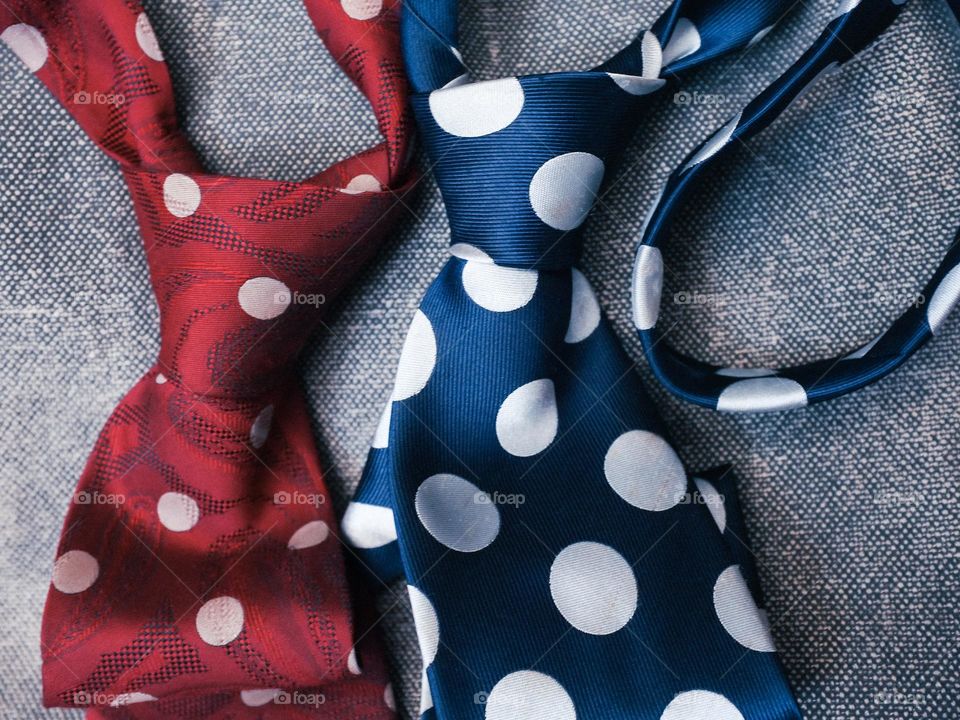 Close-up of red and blue polka dot ties