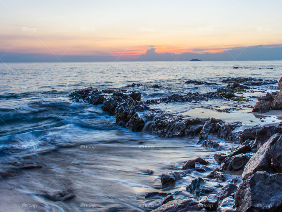 Scenic view of rocks at sea