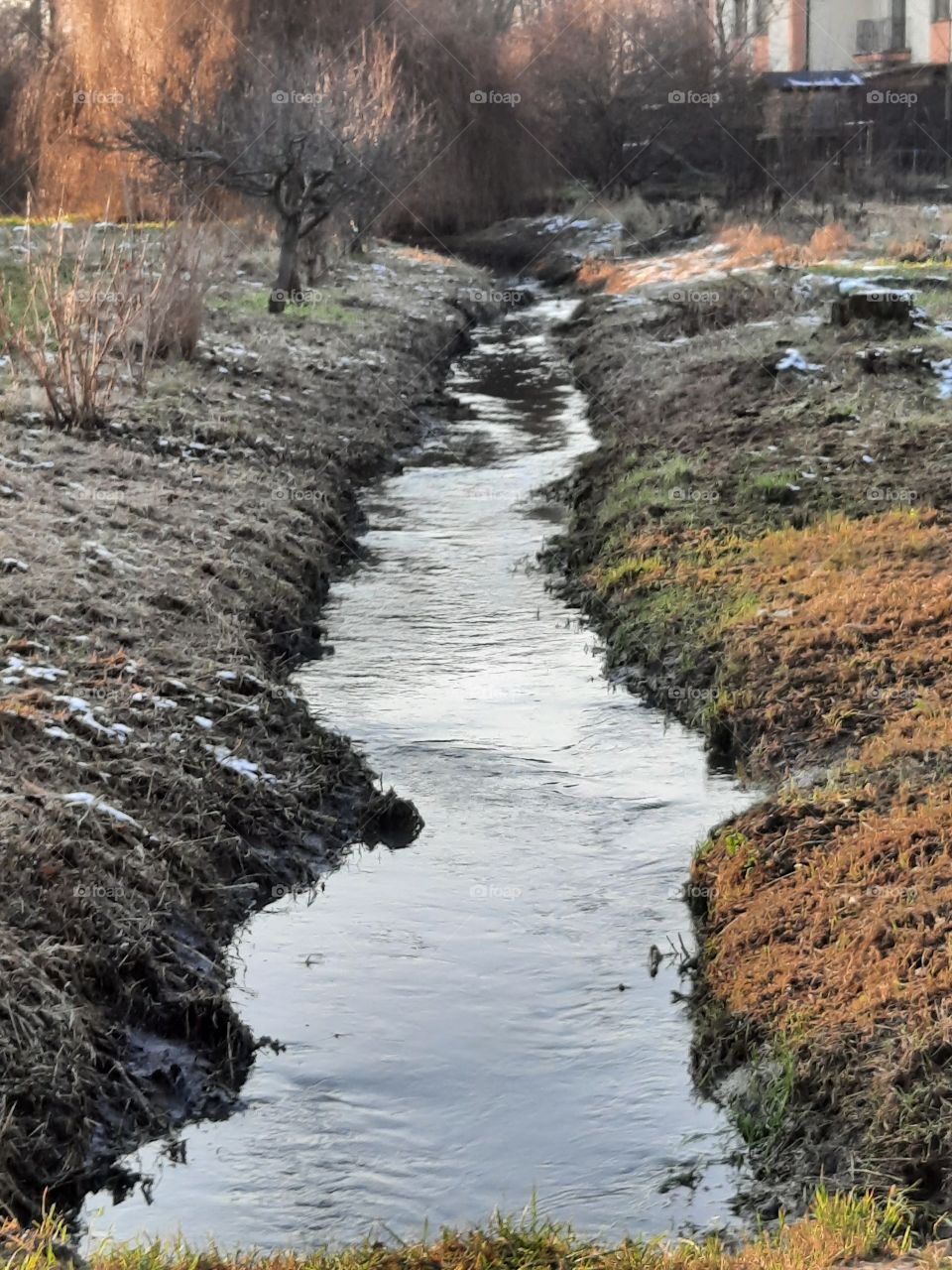 color black - black river banks in winter 2021