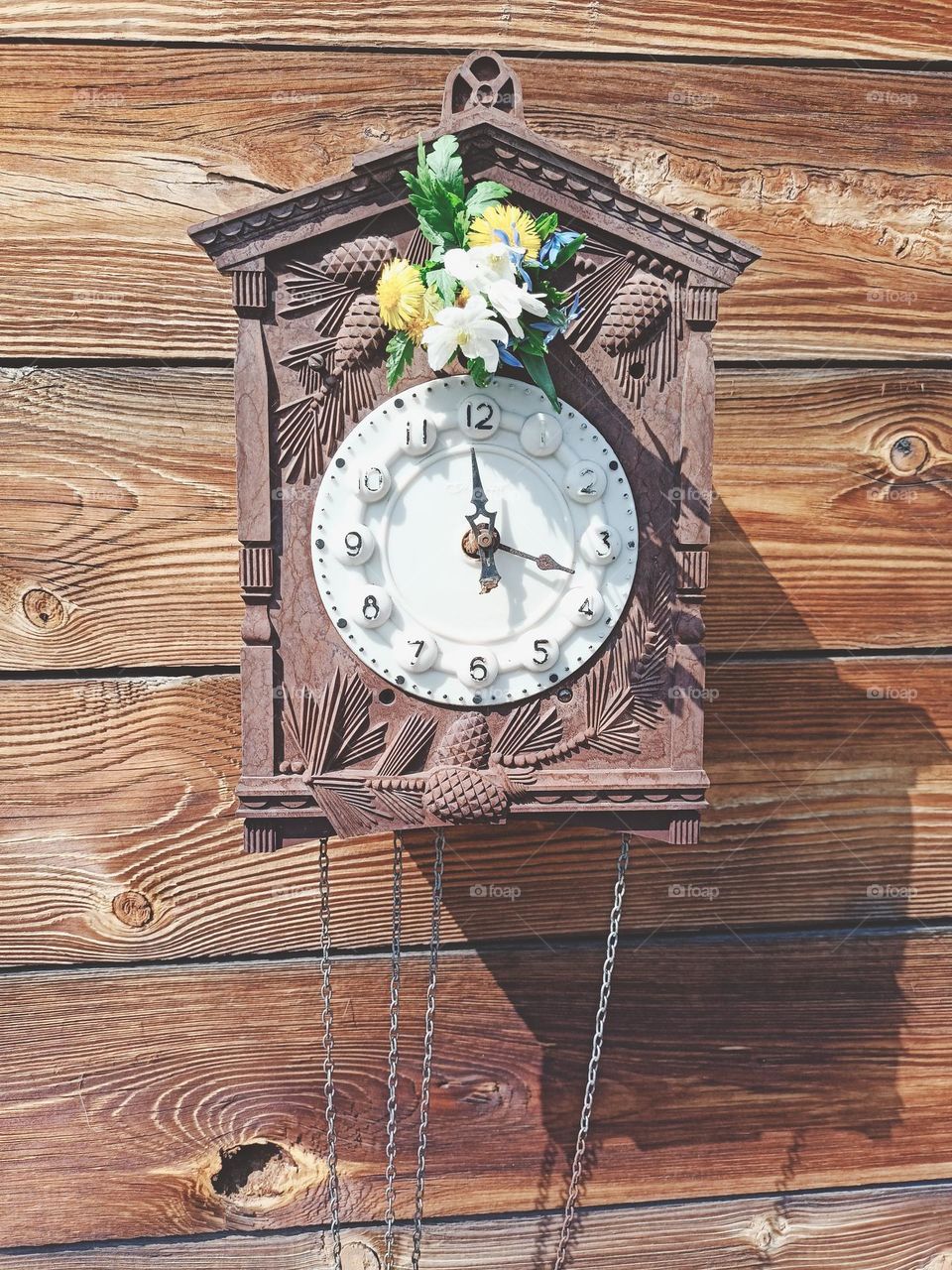 wall clock, broken clock, bouquet, spring, may, clock flowers, spring motifs, spring mood, wooden boards, house facade, flowers, chains