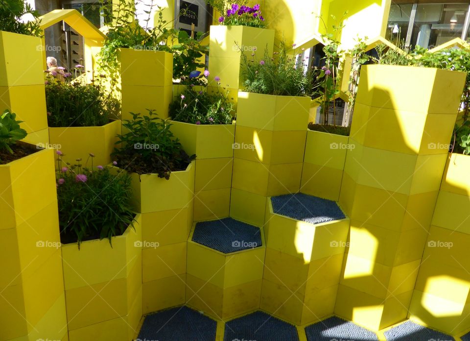 Yellow pots and chairs art 