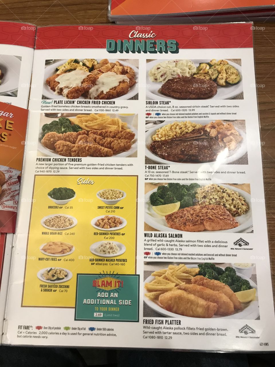 An inside page of Denny’s visual menu. On it are photos of various meals and side orders, along with the descriptive text. Customers can look and read to determine what they would like to satisfy their tummies.