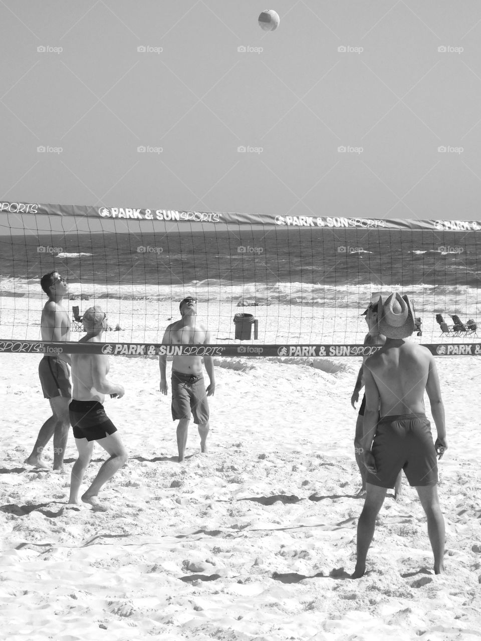 Spring breakers invade the Northwest Florida Beaches - in a good way! Spring breakers enjoy the sunny weather as they have fun playing in the sugary white sands in front of the Gulf of Mexico! Spring is here!