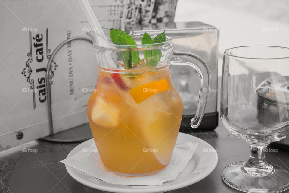 Refreshing Sangria with fruits and mint in a misted decanter