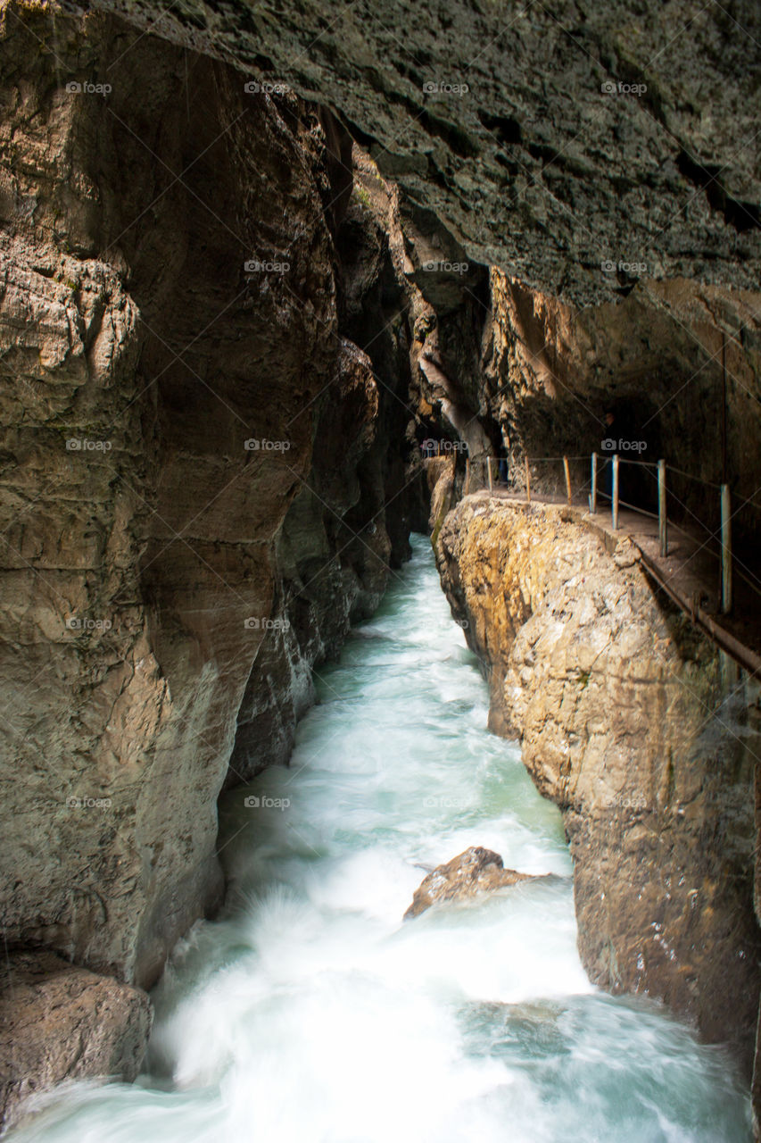 Scenic view of river flowing through rocks