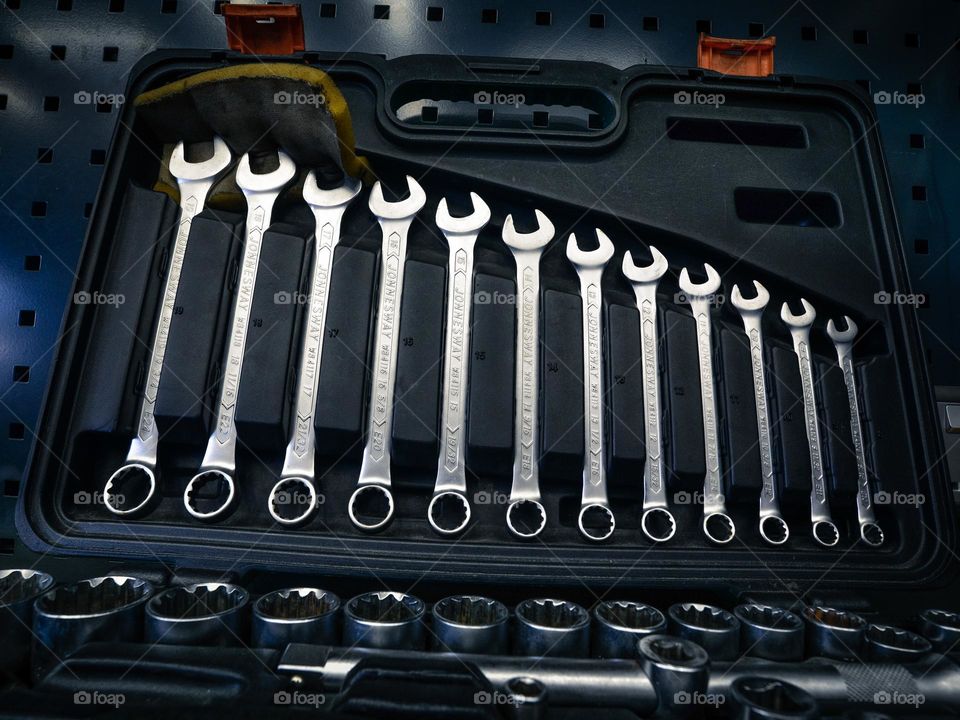 Close-up of steel spanners in a tool nox