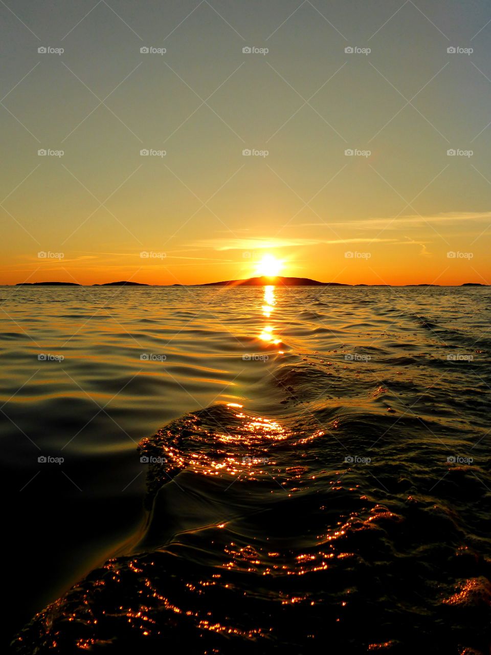 Idyllic view of sea at sunset