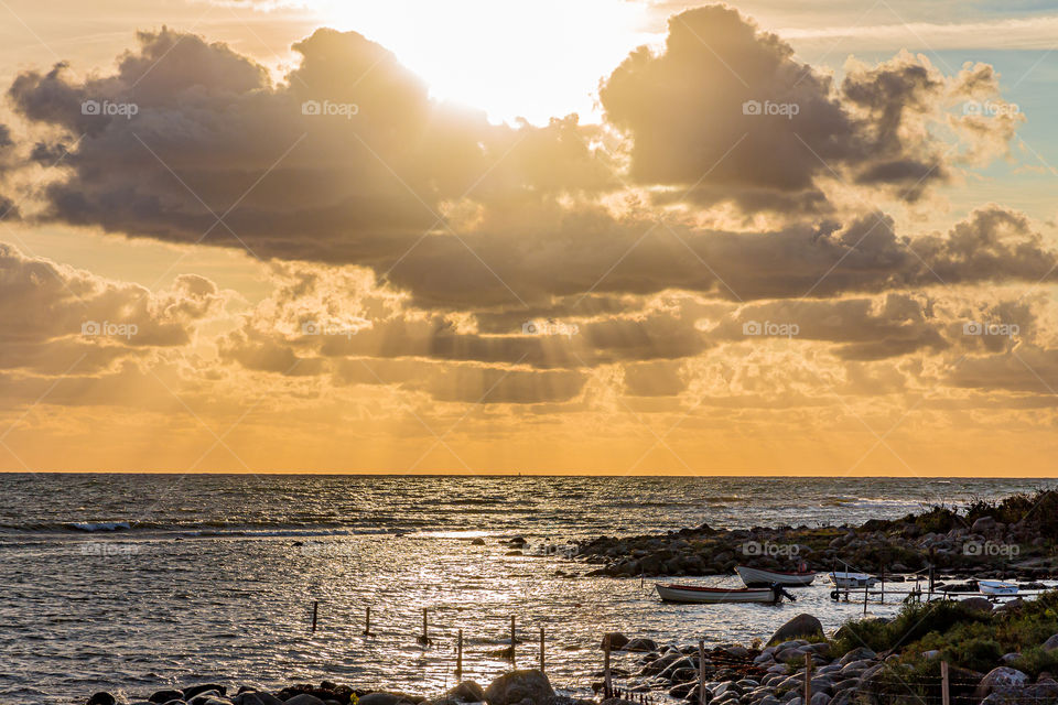 Sun shines on the ocean and seashore after stormy weather 