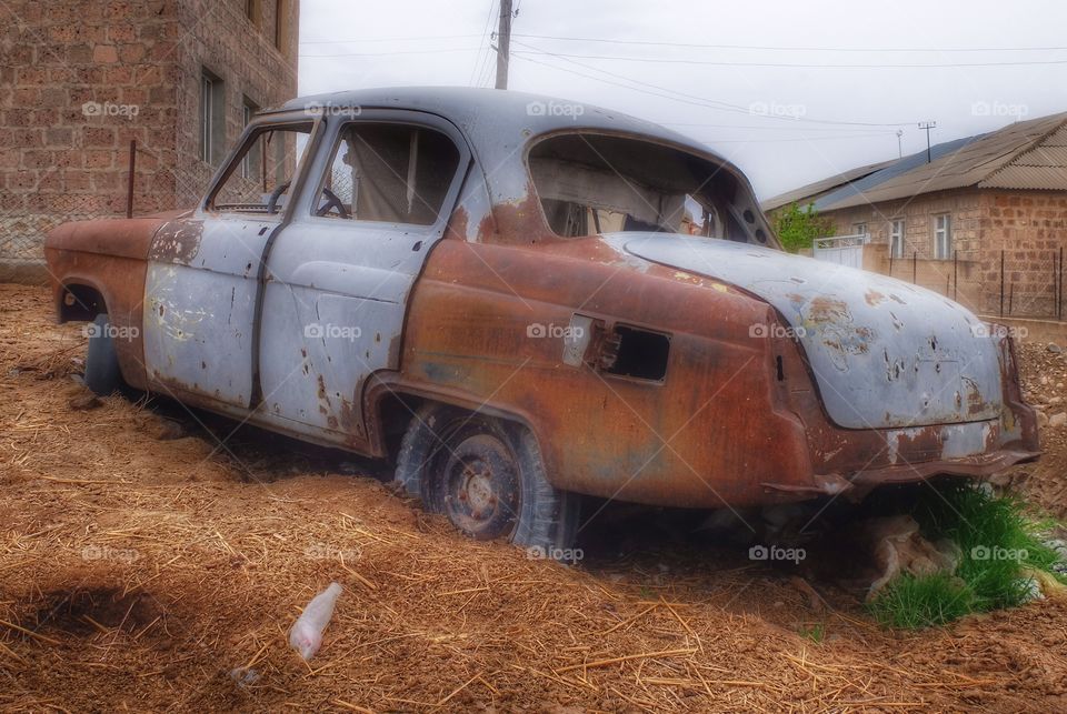 Rusty rust. 
Took this shot of old car at one Armenian village. This auto knew a better time. 