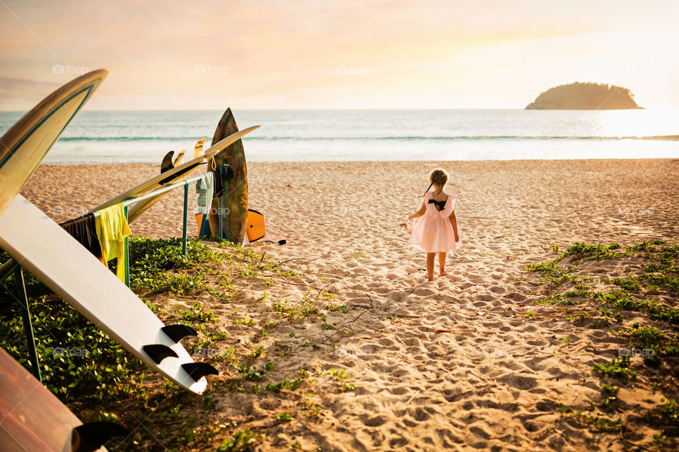 Cute little girl on the sandy beach 