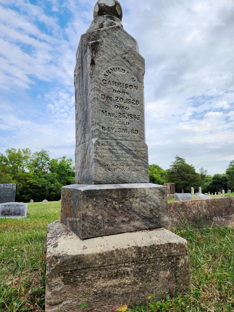 An old gravestone more than a century old still proudly stands in a remote American graveyard