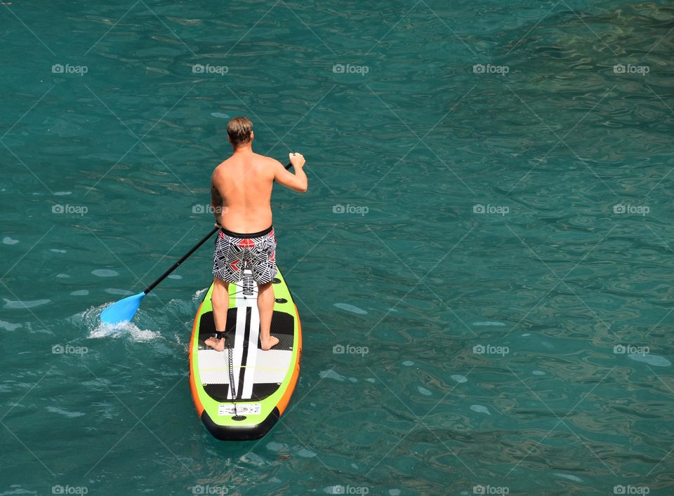 in motion on paddleboard