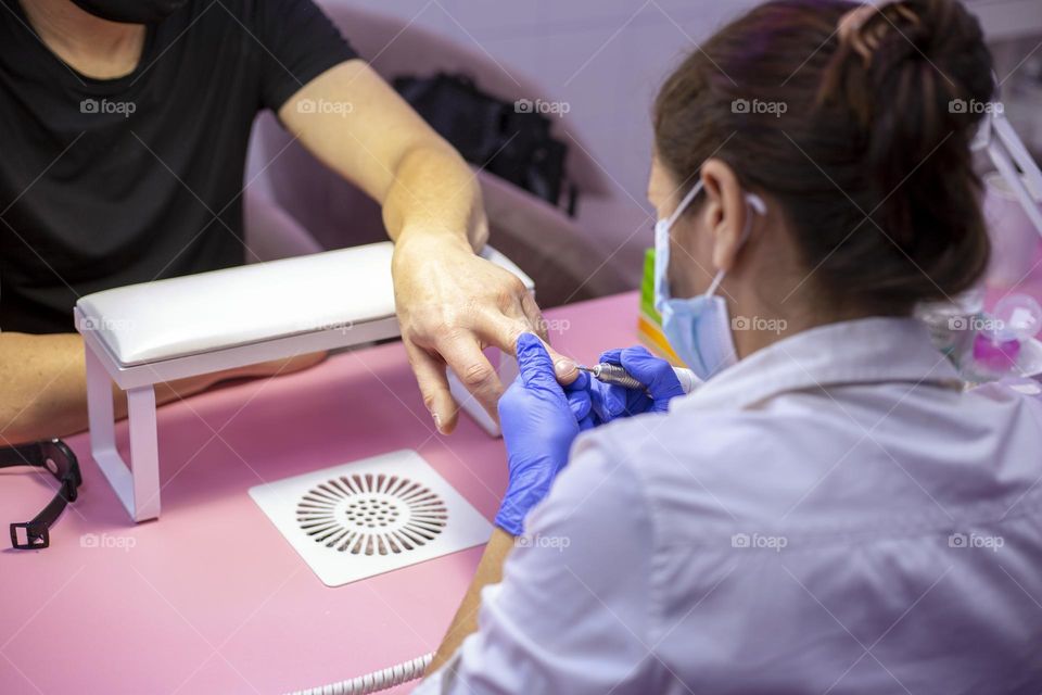 Man’s manicure in the beauty salon 