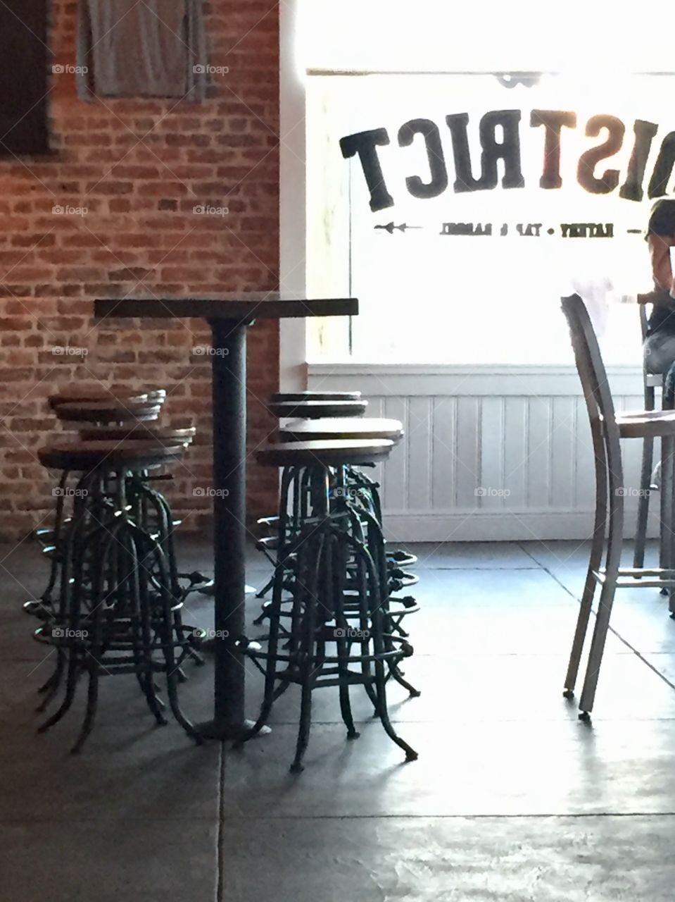 High top table and stools at a restaurant in a historic downtown building 