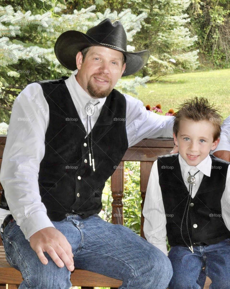 Groom and little boy sitting together 