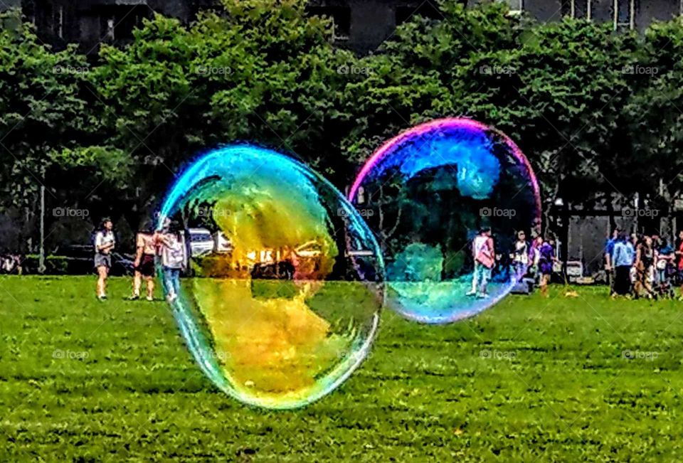 Someone blew big bubbles in the park, they were colorful and beautiful but the time of existence is too short, so many things always beautiful but not forever.