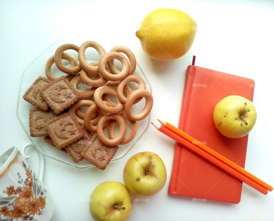 Cookies and notebook  on table