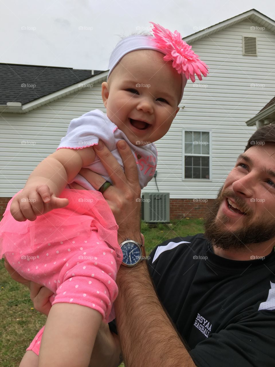 Father throwing his daughter