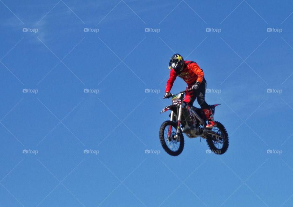 Motorcycle Jump. Expert Rider Jumping A Motorcycle High Into The Air
