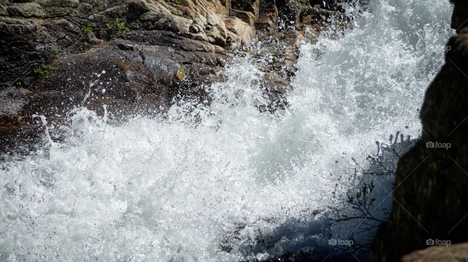Scenics view of waves crushing on rock
