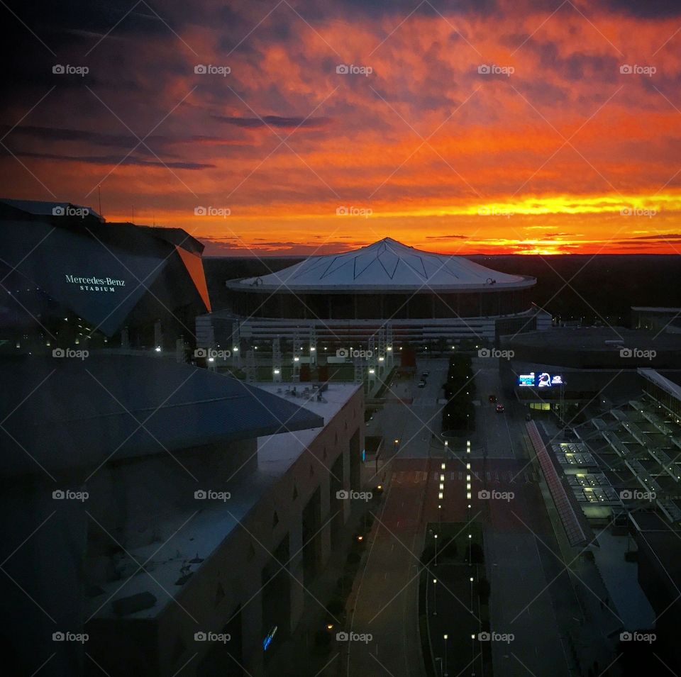 Sunset behind the Georgia Dome before its demolition. The Mercedes Benz Stadium is to the left. 