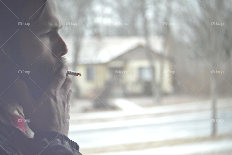 Smoker. A smoker having a cig out in the cold