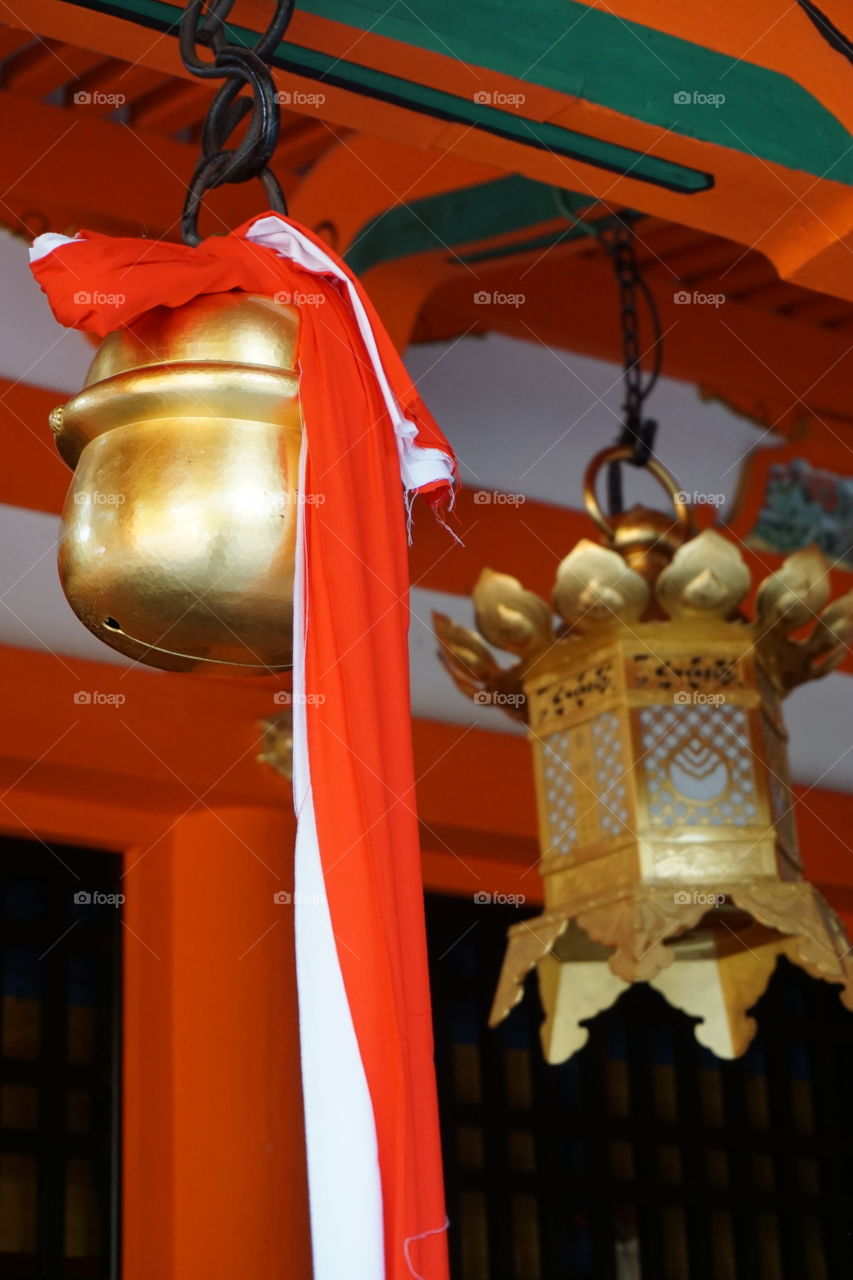 Bell and lantern at the Fushima Inari Shrine Kyoto prefecture Japan 