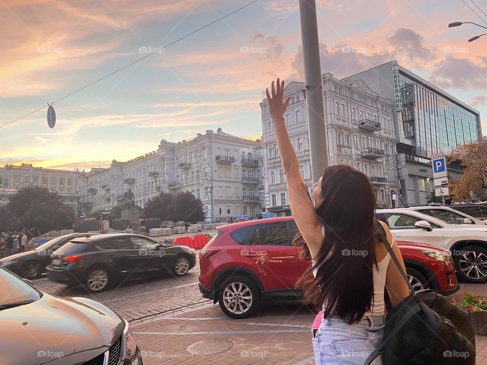 The girl waves her hand