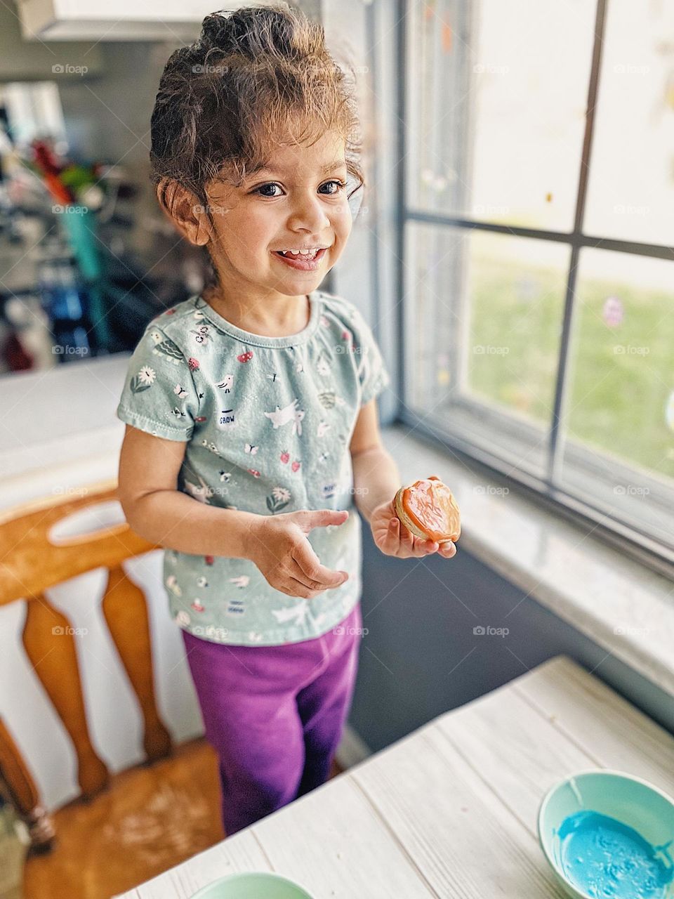 Little girl excited about Easter sugar cookies, making Easter sugar cookies with Mommy, making Easter traditions with family, family Easter traditions in the kitchen, making memories with toddlers, fun Easter cookies with toddlers