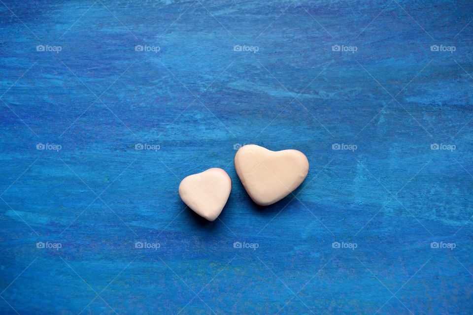 two hearts valentine's blue background