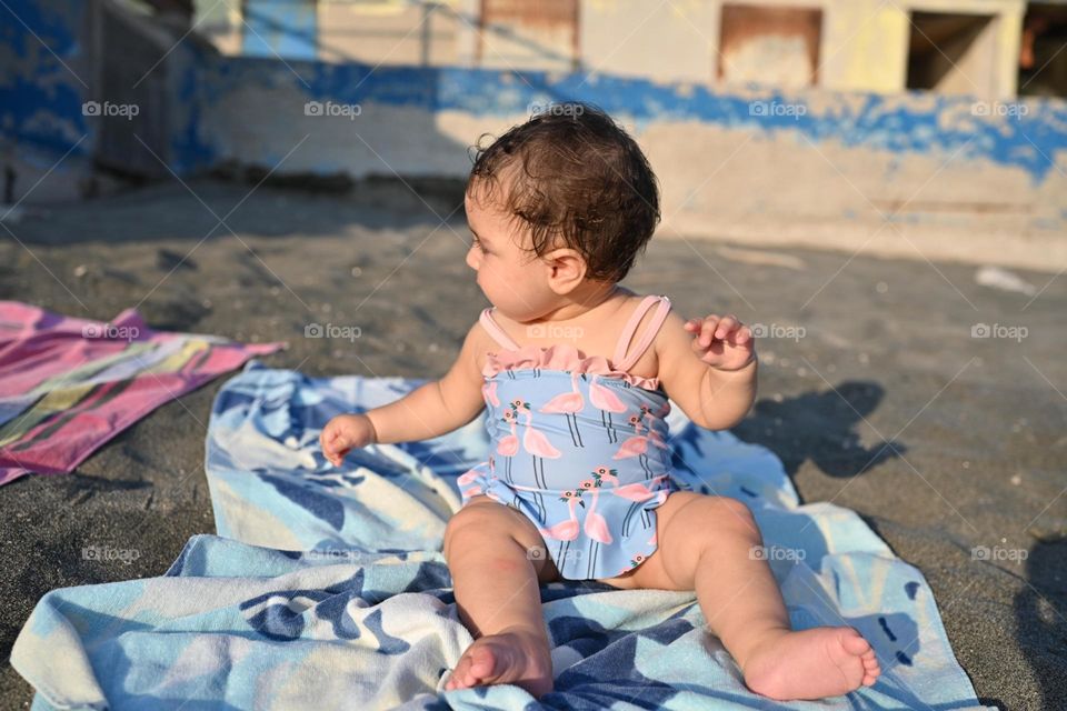 little girl playing on the beach